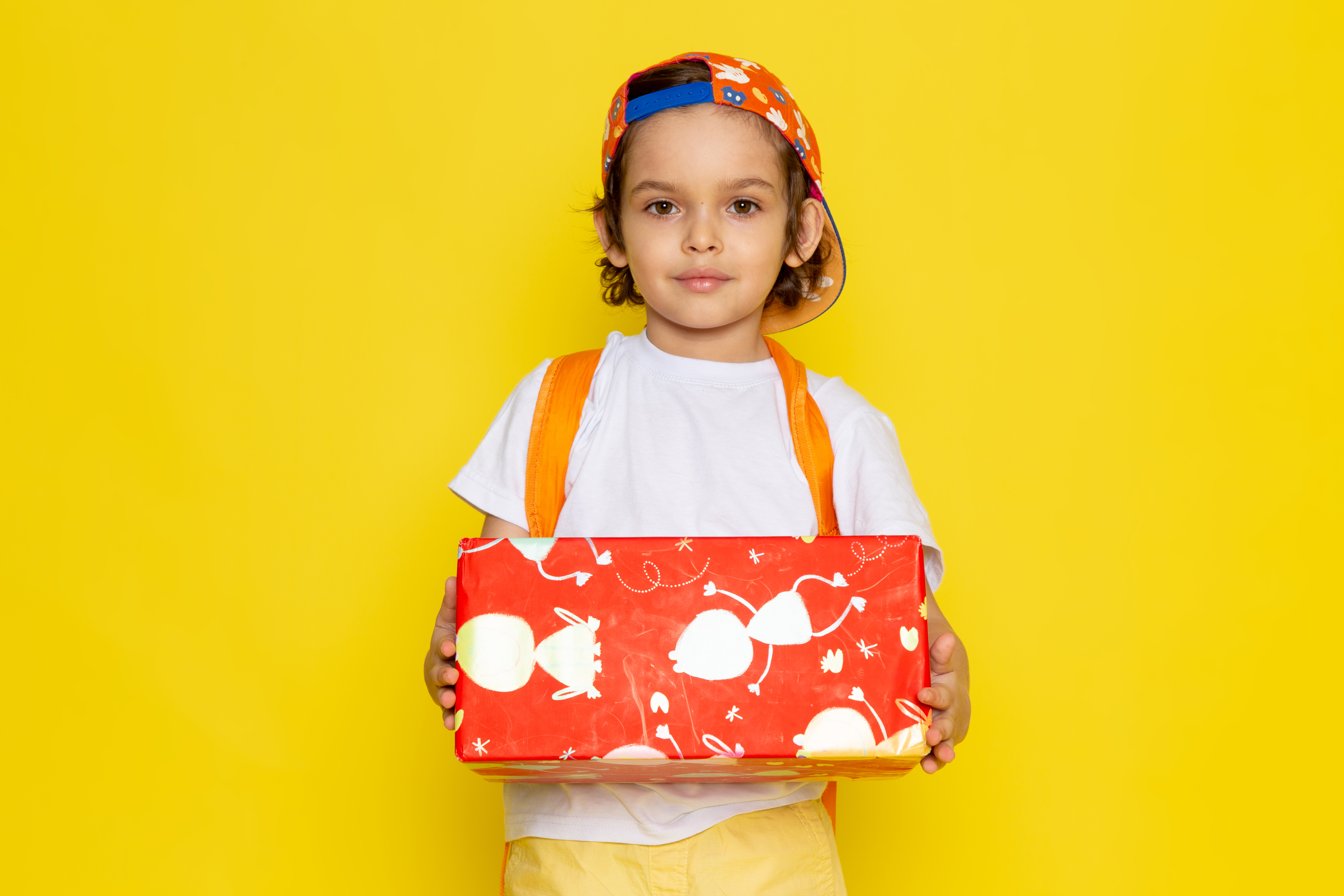 Colorful children’s gift box with toys, books, and sweets for holidays